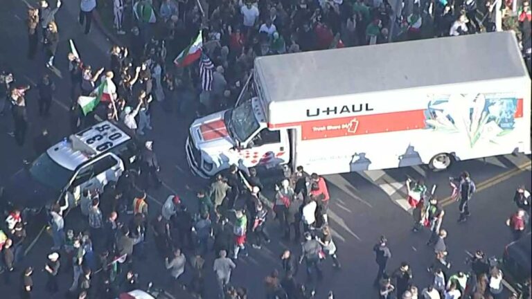 U-Haul drives through crowd of protesters in California