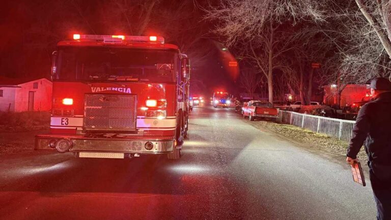 Structure fire put out after possible explosions and other structure threatened