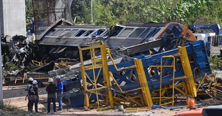 Crane falls onto moving train in Thailand, killing at least 29 in fiery derailment