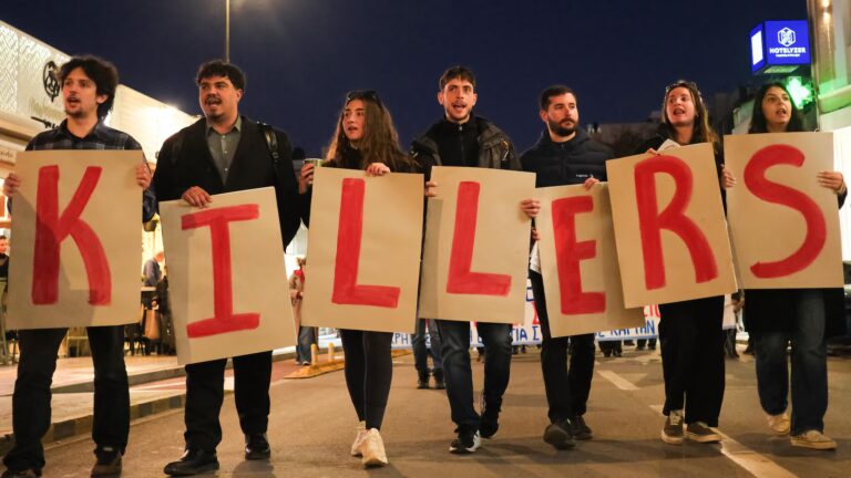 Protest held on Greek island against docked US aircraft carrier as Iran tension builds