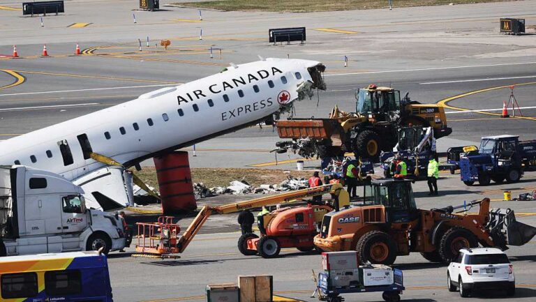 Plane in LaGuardia crash is towed from runway